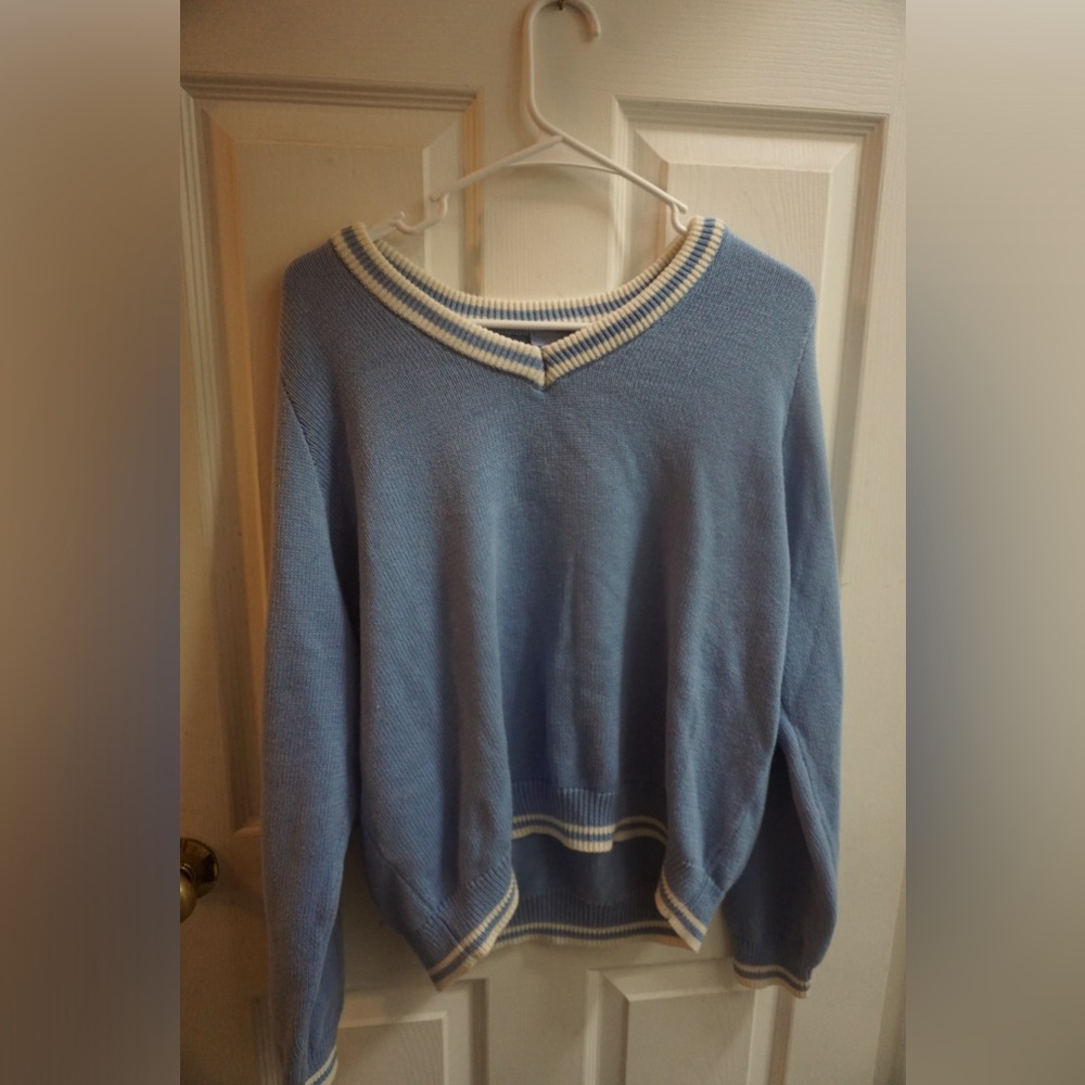 I am selling a blue and white sweater.